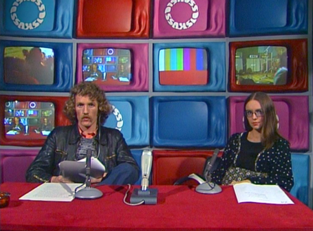 2 Persons sitting in a TV Studio
